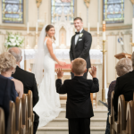 A Boy Stood Up at a Wedding, Then Others Followed, and the Entire Room Gasped! At first, guests were confused, But when more people joined in, a shiver ran through the crowd, What happened next left everyone in awe! Tears, cheers, and a moment no one will ever forget